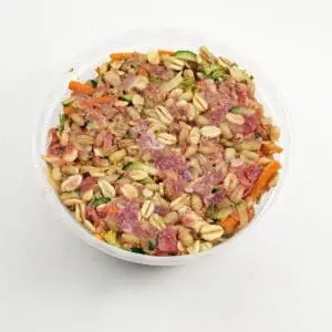 A bowl of food that is on the table.