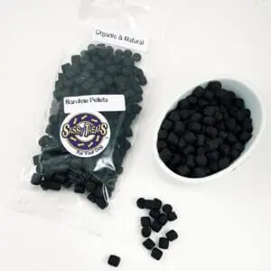 A bag of black beans next to a bowl.
