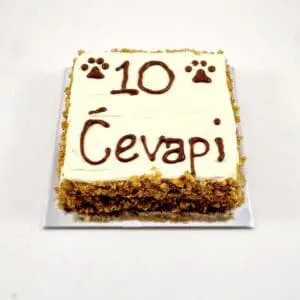 A square cake with the number ten written in chocolate on top.