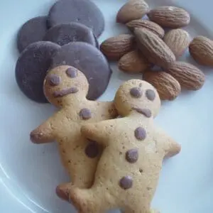 A plate with cookies and nuts on it