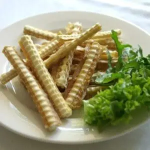 A plate of food with some kind of bread sticks